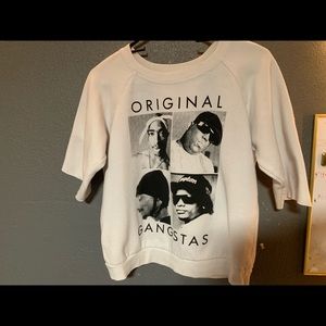 white sweatshirt with an image of artists